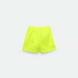 a back view for bright green short and background light grey 