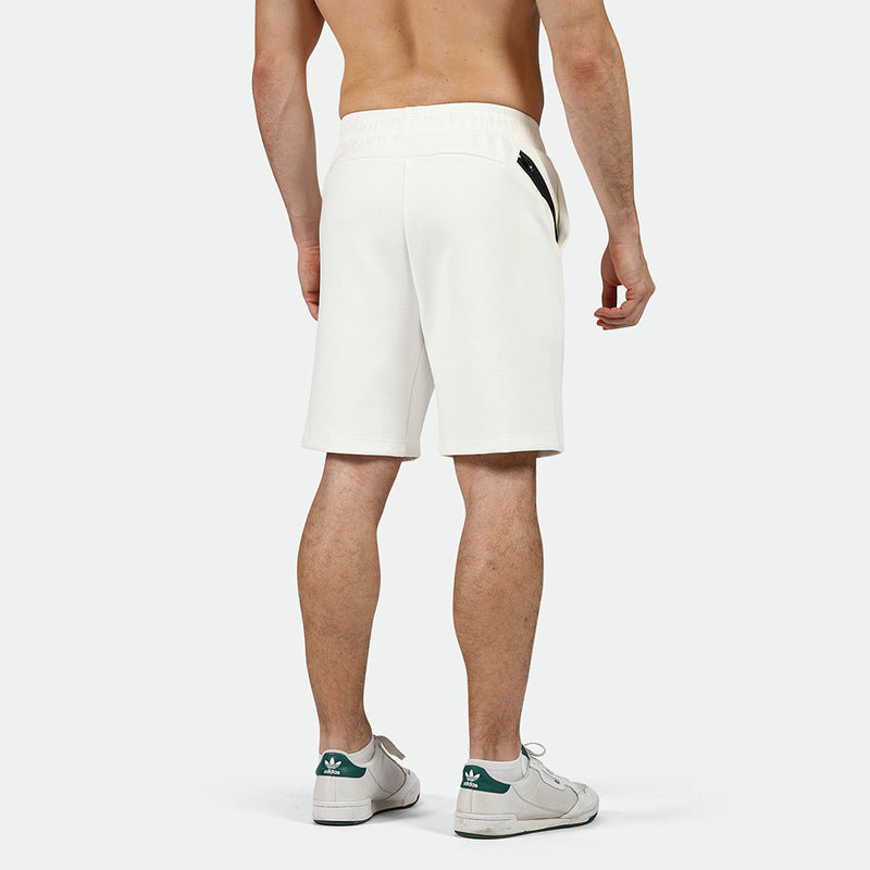 a back view for fit man wearing short white with shoes 