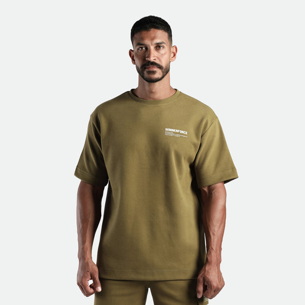 a fit man wearing matching set olive drop t-shirt  and short 
