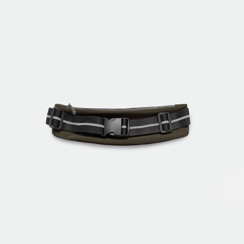 Dark green belt bag with black adjustable strap, featuring reflective gray stripes and a buckle closure, set against a plain white background.