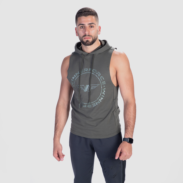 a fit man wearing  half hoodie olive green with logo and pants grey 