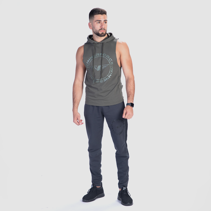 a fit man wearing half hoodie olive green with pants grey and shoes 