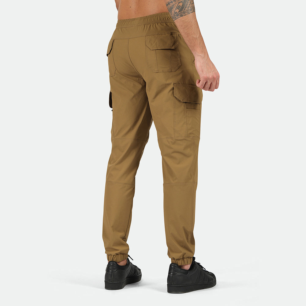 a back view for fit man wearing  cargo Breen brown with pants and shoes black 
