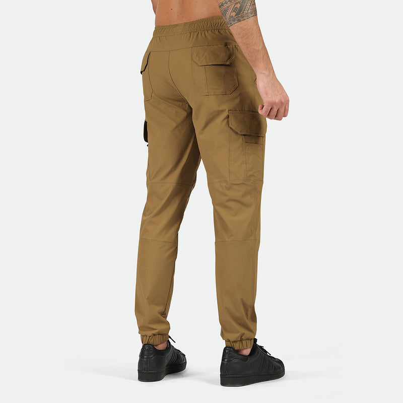 a back view for fit man wearing  cargo Breen brown with pants and shoes black 