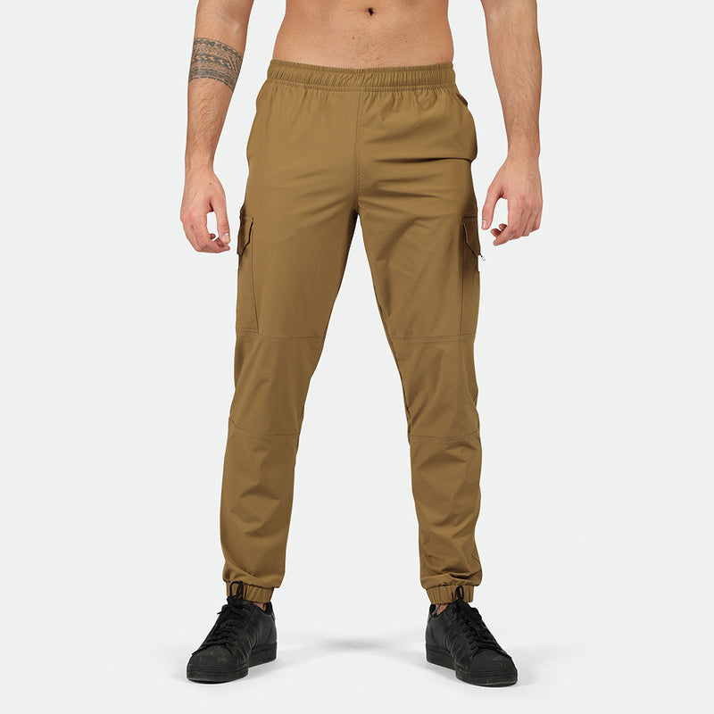 a fit man wearing  cargo Breen brown  with shoes black 