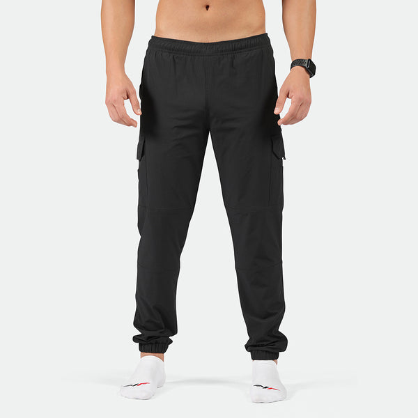 a fit man wearing  pants cargo black with socks white 