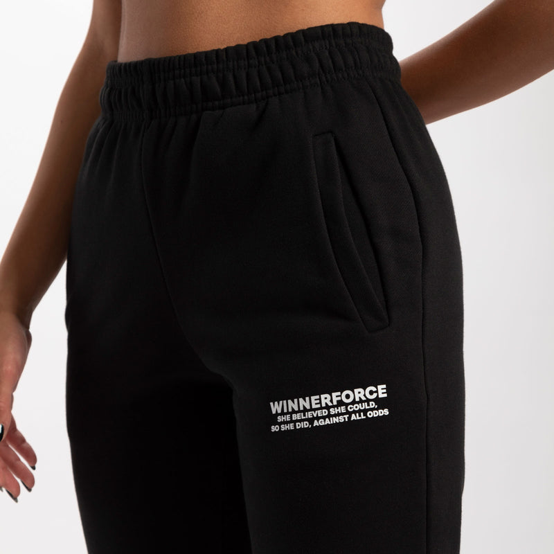 close up view for pocket of pants with logo white ,plus the background is light grey 