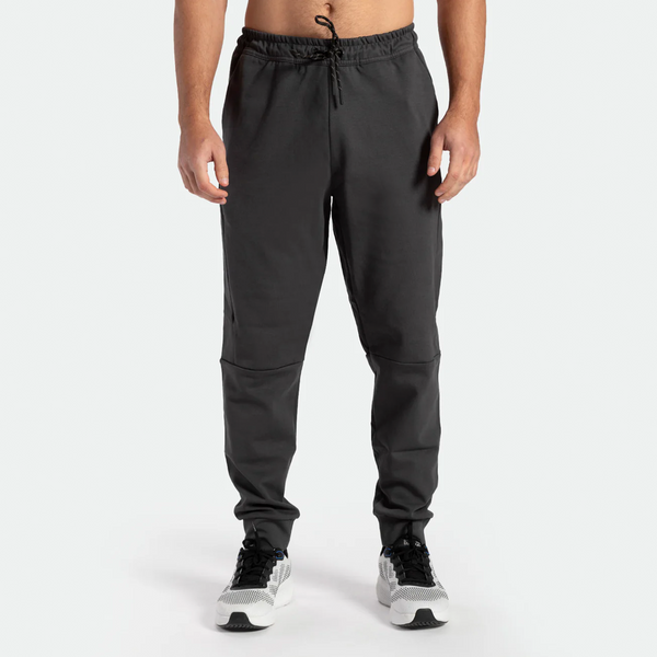 a fit man wearing pants grey ebony with shoes sports 