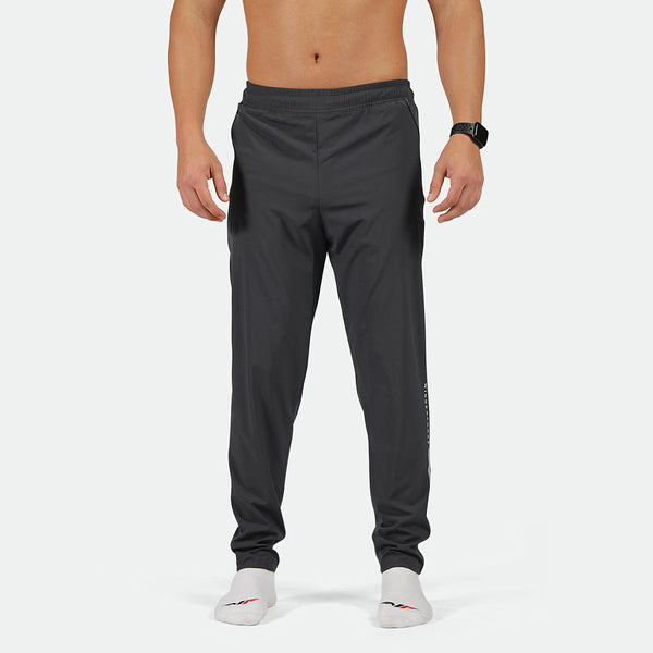 a fit man wearing  pants  phantom grey  with socks white 