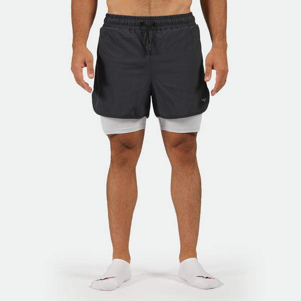 a fit man wearing short phantom grey  2 in 1 with  socks white 