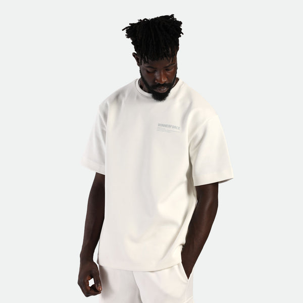 a fit man wearing matching set  off white  ,t-shirt with logo and short 