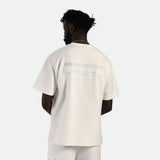 a back view for fit man wearing matching set  off white t-shirt with logo and  short 
