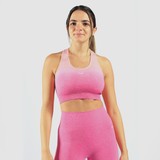 a woman wearing  matching  bra and legging  pink ,have same logo