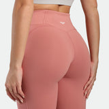 Pink leggings with a brand logo on a white background