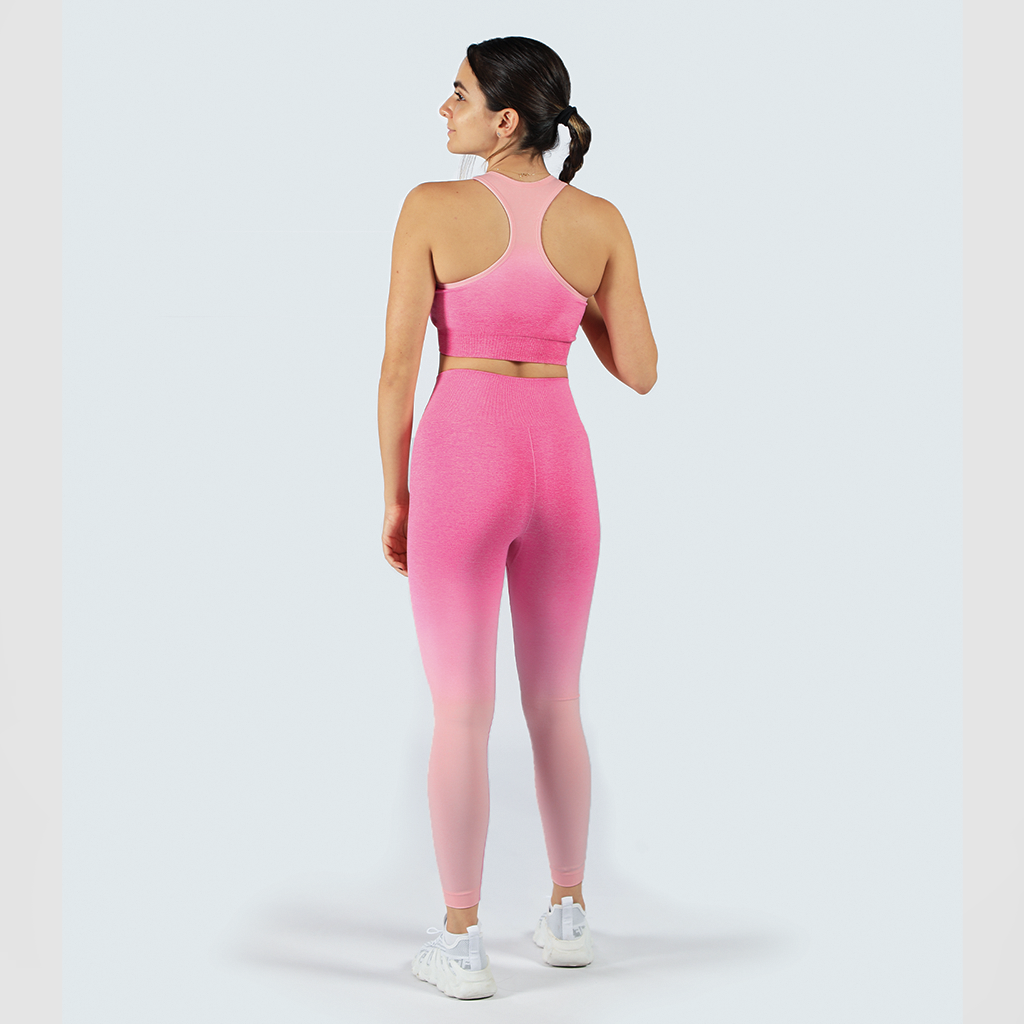 a back view for fit woman  wearing matching bra and legging with sneakers white 