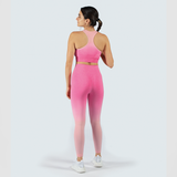 a back view for fit woman  wearing matching bra and legging with sneakers white 