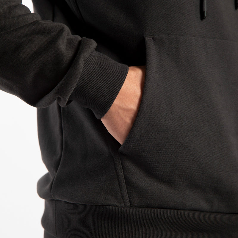 close up view for person wearing hoodie pirate black and here hand in pocket  