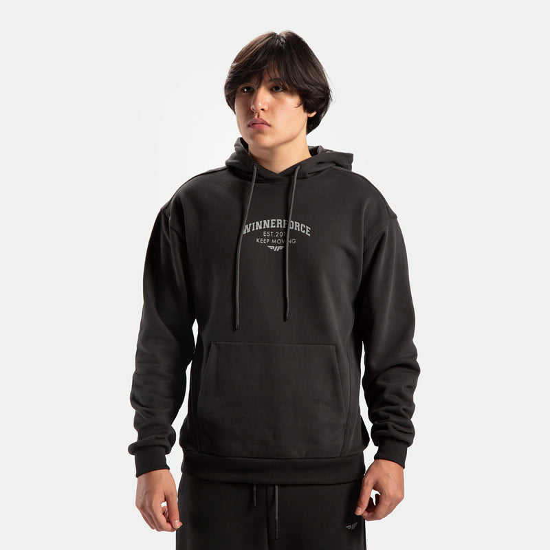 a fit man wearing matching set pirate black  hoodie with logo and pants 