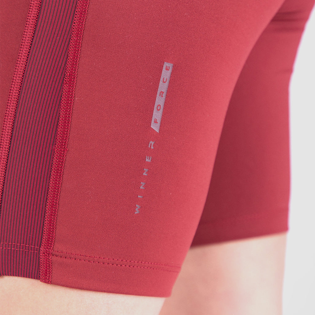 close -up view for  short red with little mesh fabric and logo ,plus the background is light grey 