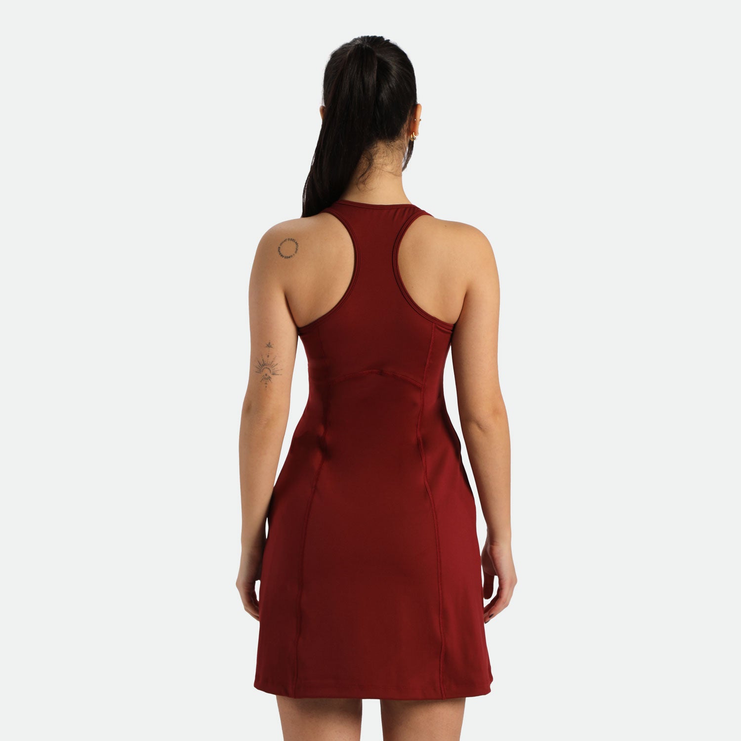 a back view for fit woman wearing  dress red 