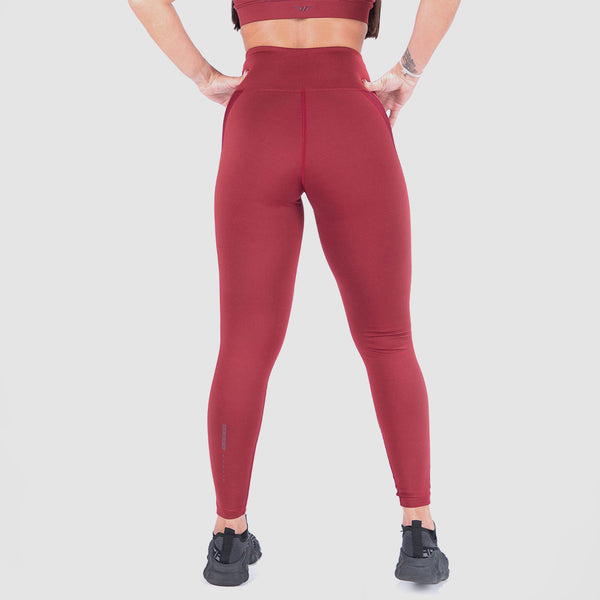a back view for woman wearing legging red and shoes black ,the background is light grey 