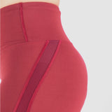 close up view for short red with little mesh fabric ,plus the background is light grey 