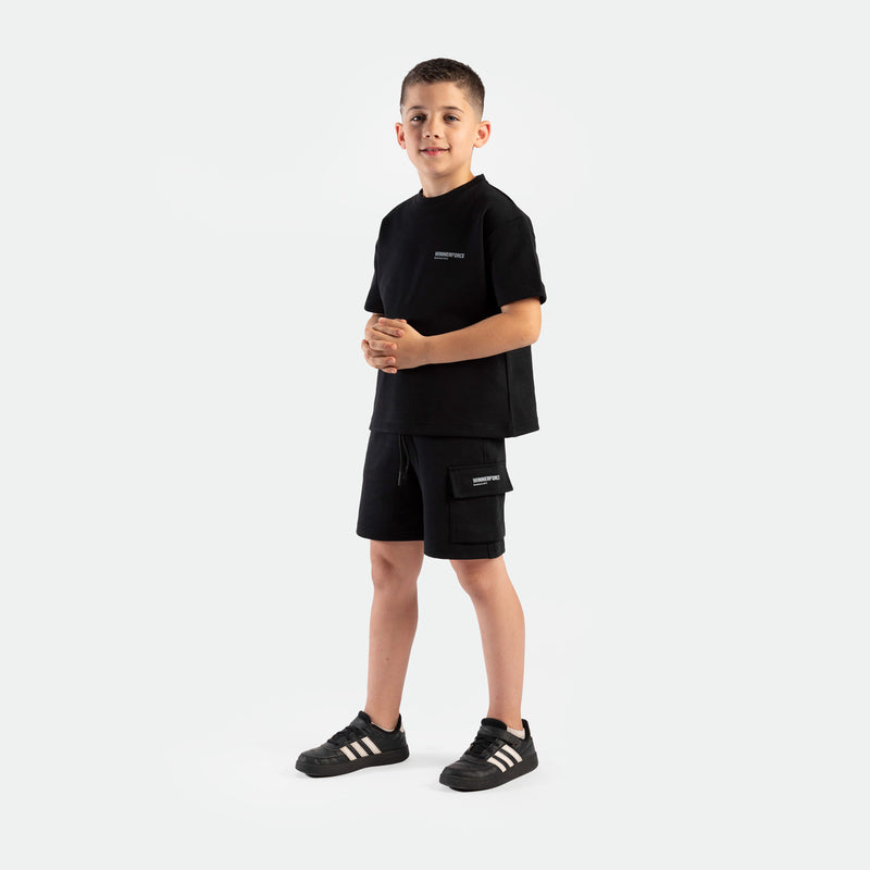 a young boy wearing matching set black ,t-shirt and short ,plus shoes