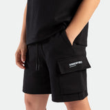 close down view for boy wearing short black with logo 