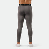 a back view for fit man wearing QUIEST-SHADE-GREY legging with logo plus socks 
