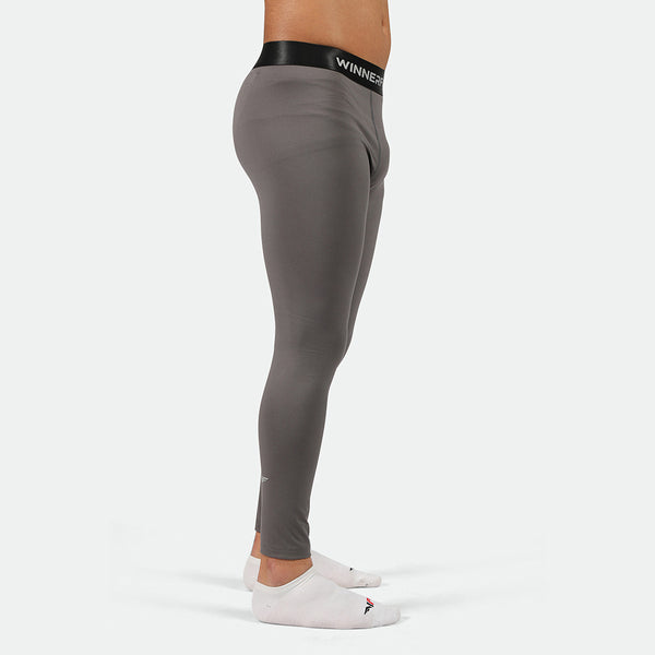 a fit man wearing legging  quiest shade grey with socks white 