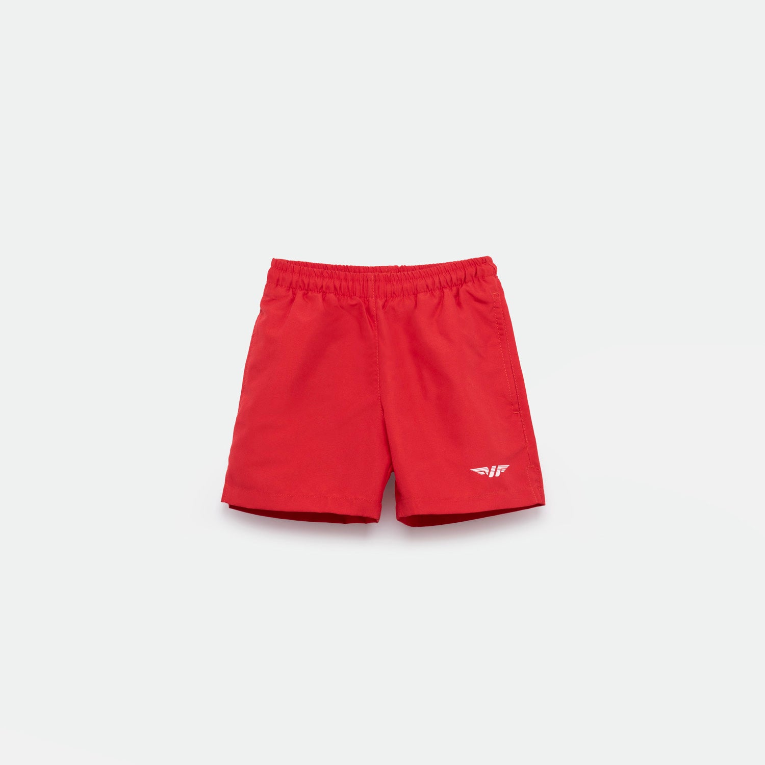 Bright red athletic shorts laid flat on a light background. The shorts have a small white logo on the lower left side and feature a simple, sporty design