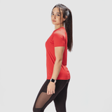 a slim woman stand at right, and she wearing t-shirt red with legging black have a little mesh fabric black 