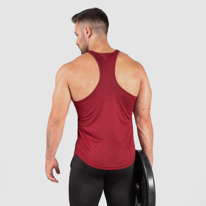 a back view for fit man wearing tank dark red with pants black 