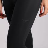 close up view for woman wearing legging black with logo 