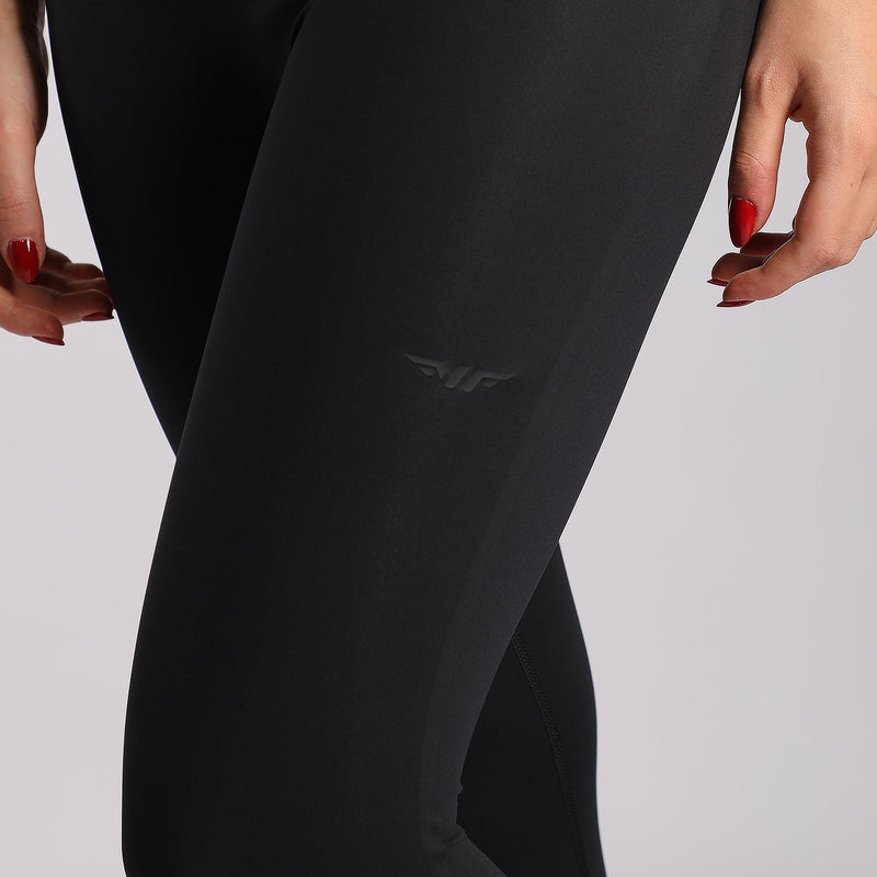 close up view for woman wearing legging black with logo 