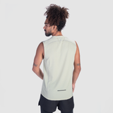 a fit man wearing tank sage green with short black 2 in 1