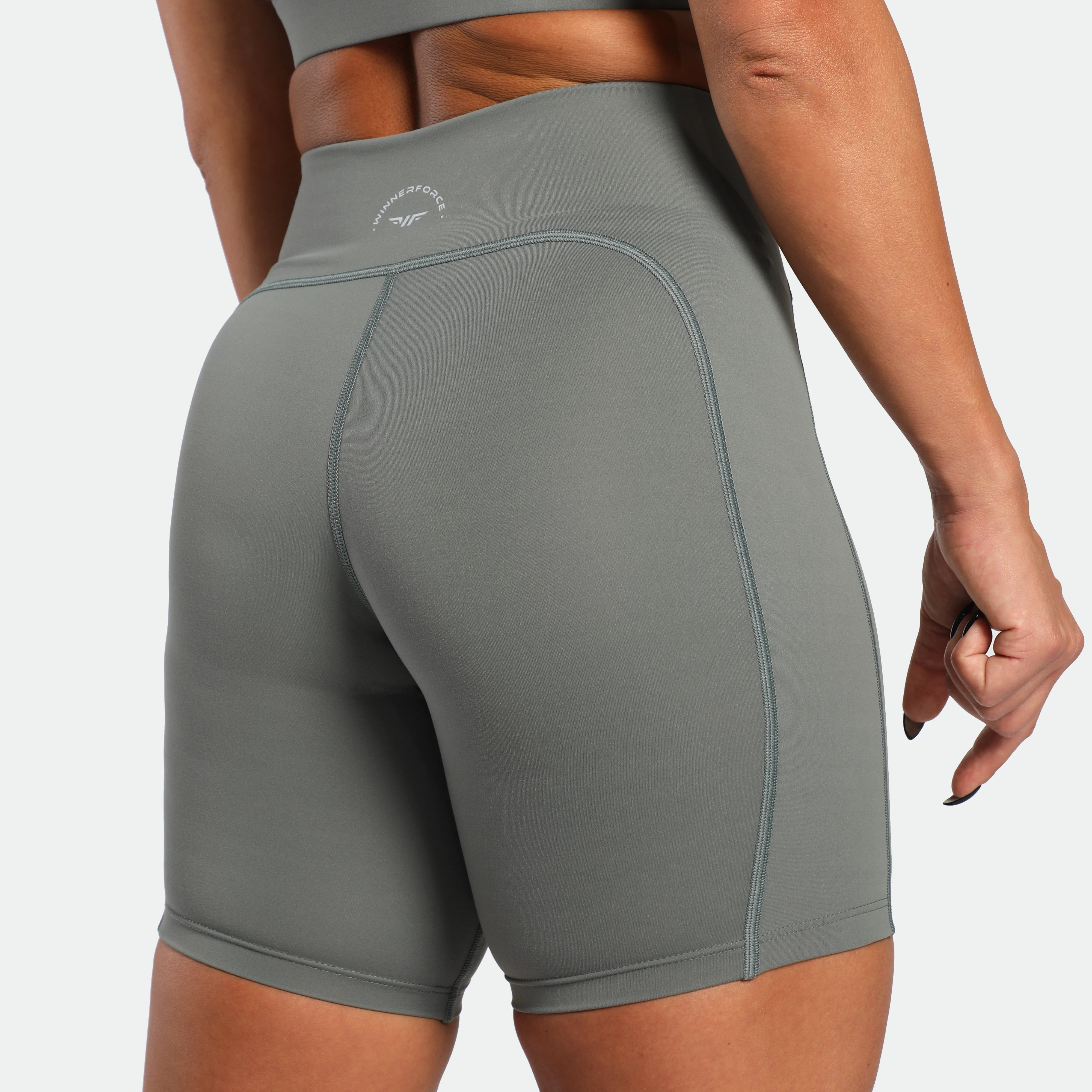 a back view for back view of woman wearing short sage grey 