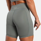 a back view for back view of woman wearing short sage grey 