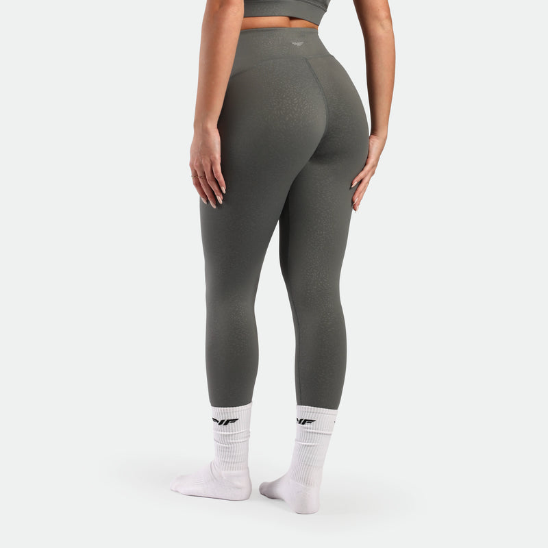 a bac view for fit woman wearing legging sage grey terrazzo socks white 