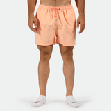 a fit man wearing  shot SALMON-PINK with socks 