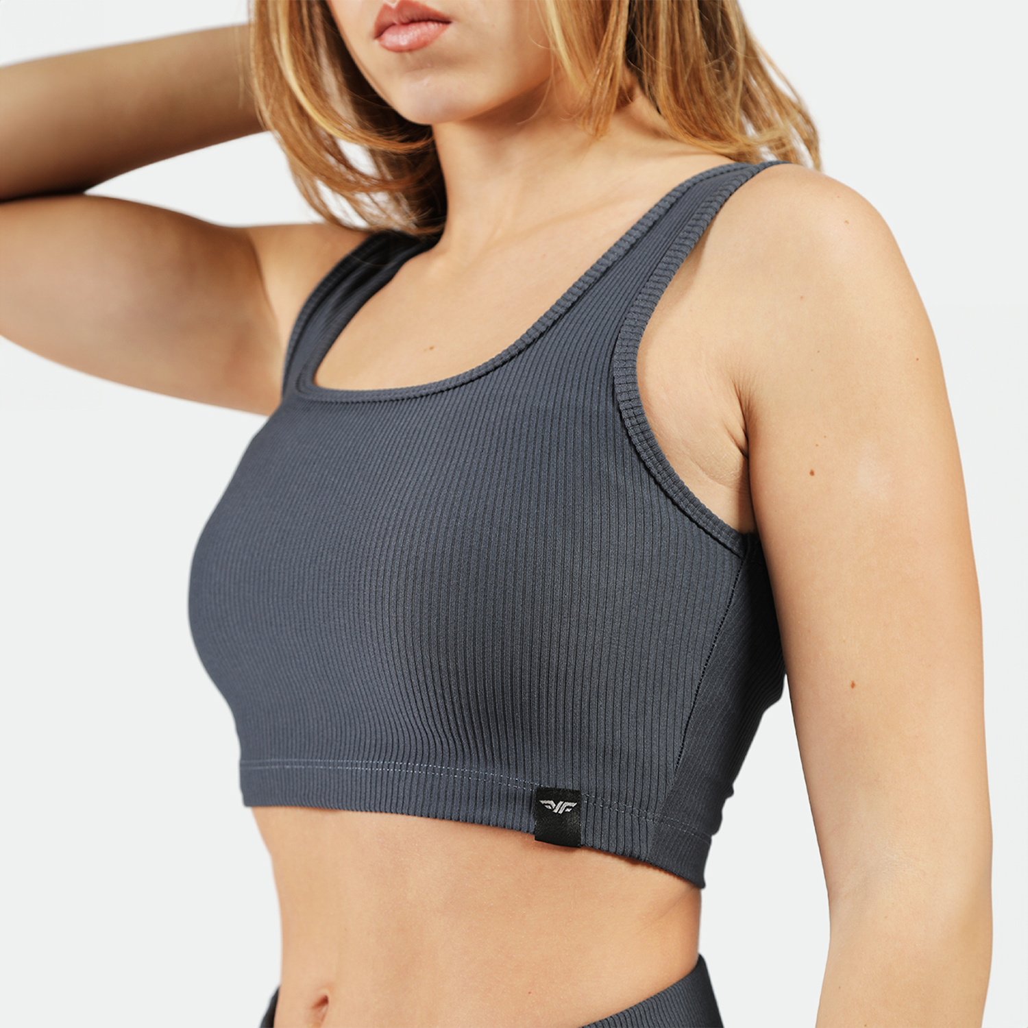 close up view for fit woman wearing  crop top grey 