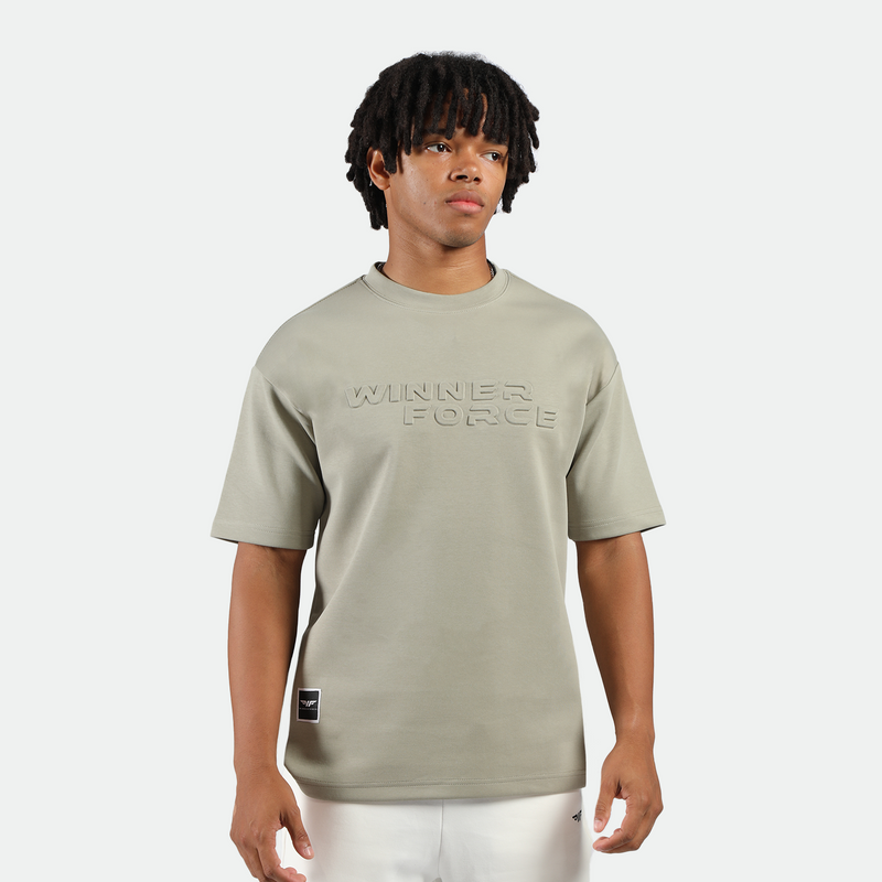 a fit man wearing t-shirt seagrass green with short white 