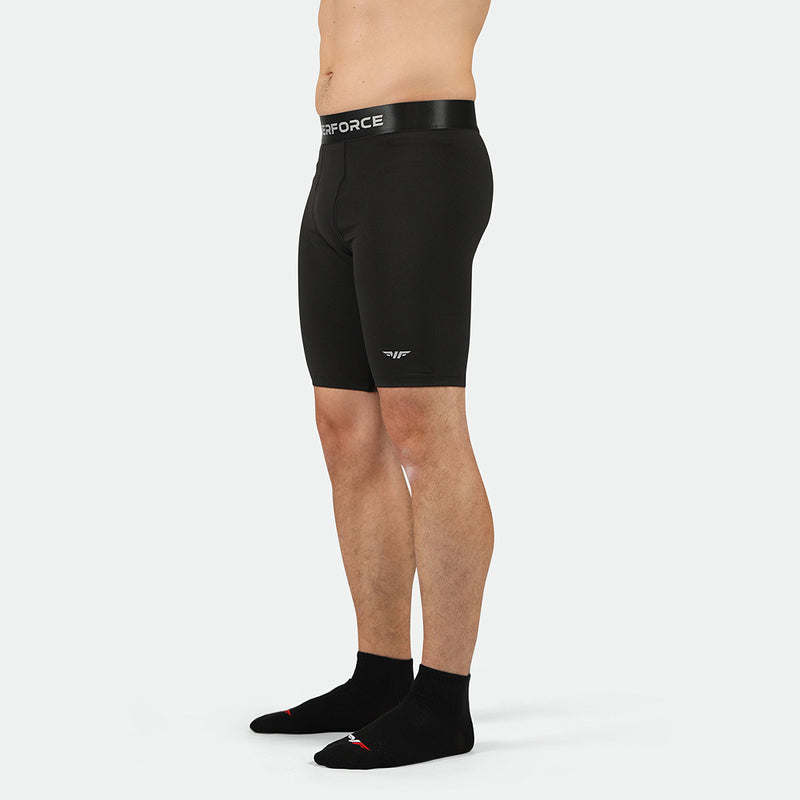 a fit man stand at right and wearing short black with socks black 