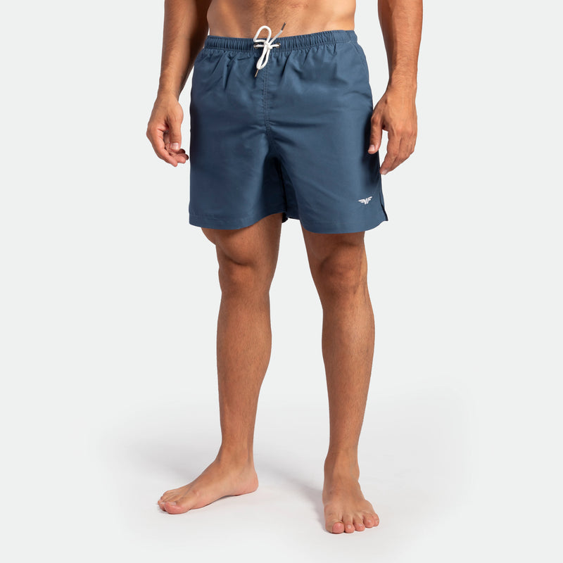 a fit man wearing short ensign blue 