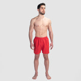 a fit man wearing short red 