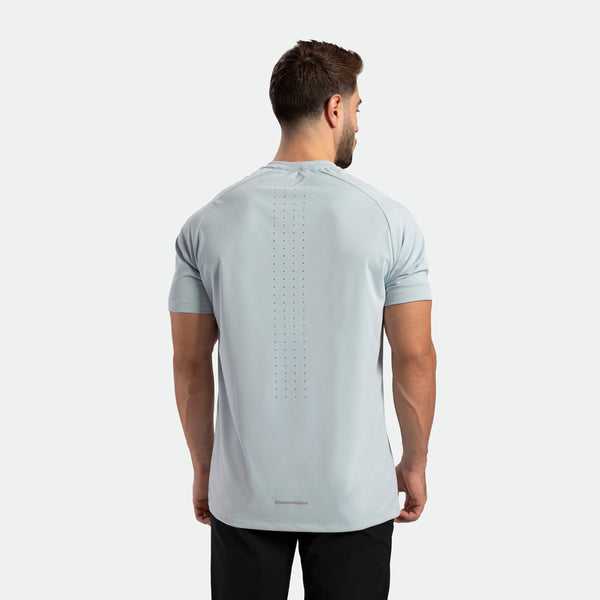 a back view for fit man wearing t-shirt sky blue with pants black 