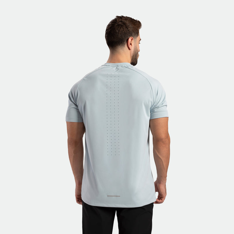 a back view for fit man wearing t-shirt sky blue with pants black 