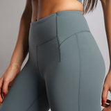 close up view for fit woman wearing flared legging  stormy grey 