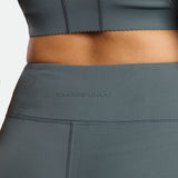 a back view for fit woman wearing flared legging with crop top stormy grey 