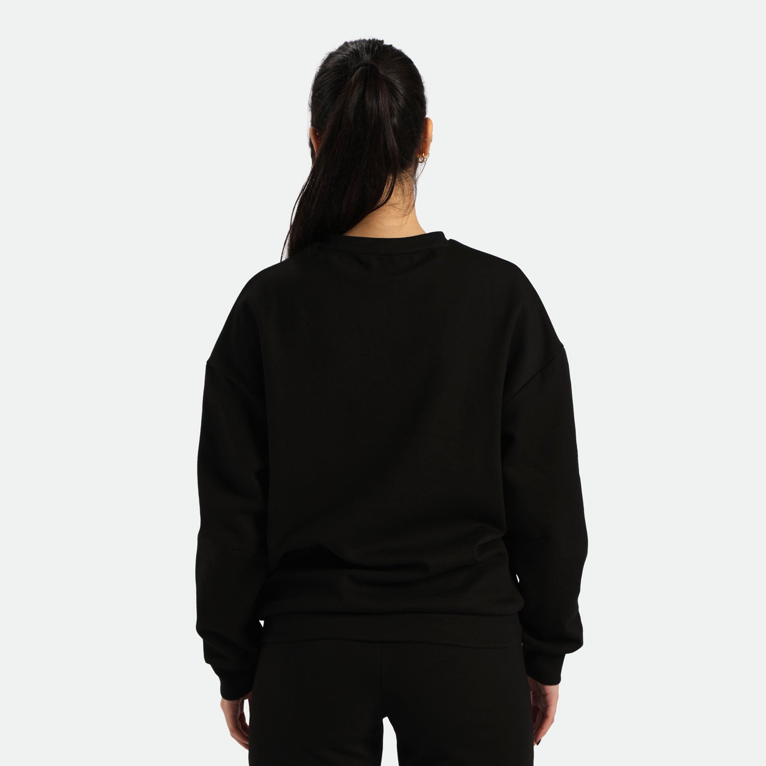 a back view for fit woman wearing sweatshirt and pants black 